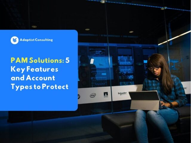 Employees monitoring cybersecurity dashboards and managing system access rights through the Privileged Access Management (PAM) platform in the IT control room.