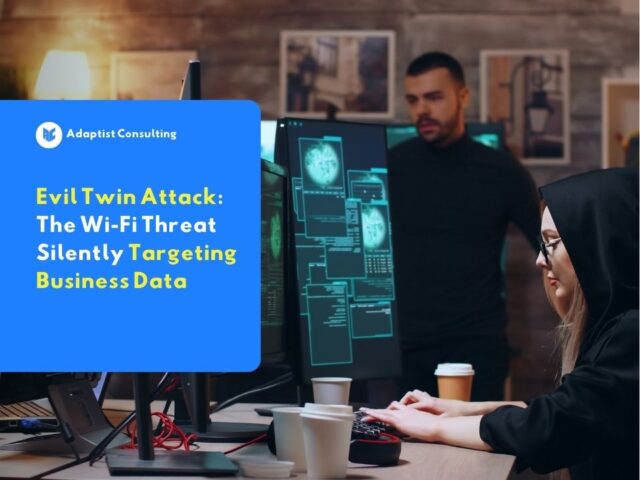 A hacker silently intercepts business network traffic through an Evil Twin Attack, monitoring victim activity across multiple screens in a dark workspace.