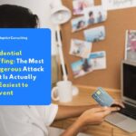 A professional holding a credit card in front of a laptop, representing the threat of credential stuffing against business digital account security.