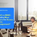 A person analyzing data security architecture on a monitor screen to determine the appropriate RBAC vs ABAC implementation for an enterprise protection system.