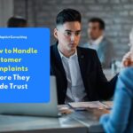 Illustration of a customer service representative speaking with a customer in an office about handling customer complaints to maintain trust.