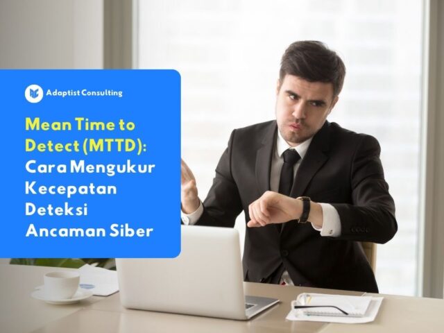 Seorang pengusaha berkemeja yang sedang memeriksa jam tangannya sambil bekerja di depan laptop, menggambarkan betapa pentingnya kecepatan deteksi dalam keamanan siber.
