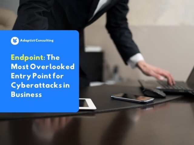 An employee monitoring three devices at once, including a laptop, smartphone, and tablet, each connected to the company network as a real-world example of endpoints in a daily work environment.