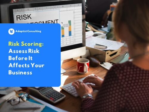 A professional working on a laptop displaying a risk assessment dashboard, illustrating the concept of structured risk scoring in business operations.