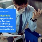 Residual Risk illustration: seorang profesional terlihat cemas sambil memeriksa dokumen di kantor, menggambarkan risiko tersembunyi yang masih tersisa meski kontrol keamanan telah diterapkan.