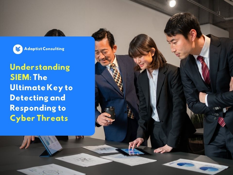 A team of professionals discussing and analyzing security data on a tablet illustrating the importance of understanding SIEM as the main key to detecting and responding to cyber threats.