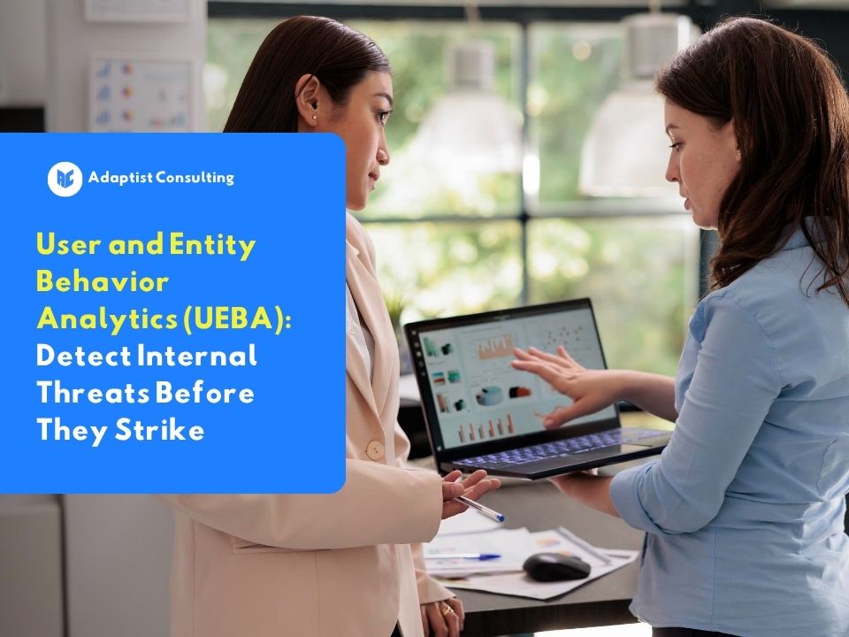 Two IT security professionals analyzing user behavior data on a laptop using User and Entity Behavior Analytics (UEBA) to detect internal threats within an organization.