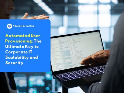 Information technology staff discussing automated user provisioning strategies for business infrastructure security in front of a laptop.