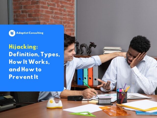 Illustration of hijacking in a workplace setting, an employee quietly accessing a colleague's data on an office computer without being noticed