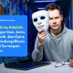 Ilustrasi hacking pada sistem bisnis dengan hacker memegang topeng di depan laptop sebagai simbol serangan siber dan keamanan data perusahaan