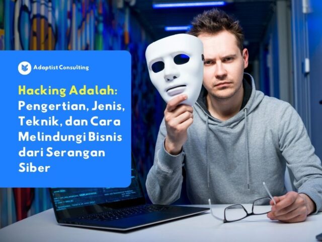 Ilustrasi hacking pada sistem bisnis dengan hacker memegang topeng di depan laptop sebagai simbol serangan siber dan keamanan data perusahaan
