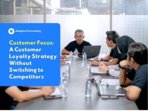 Employees discussing designing a customer focus strategy to increase B2B client loyalty and retention.
