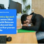 Karyawan yang sedang mengakses banyak aplikasi berbeda secara bersamaan di perangkat kerja, mencerminkan tantangan identity sprawl dalam manajemen identitas digital perusahaan yang kompleks.