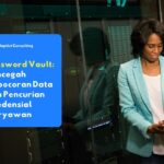 Seorang karyawan yang sedang fokus bekerja di depan layar komputer sambil mengakses data perusahaan secara aman menggunakan password vault.