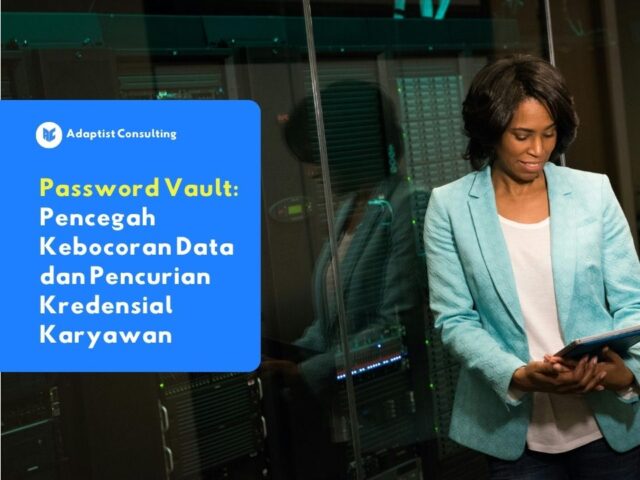 Seorang karyawan yang sedang fokus bekerja di depan layar komputer sambil mengakses data perusahaan secara aman menggunakan password vault.