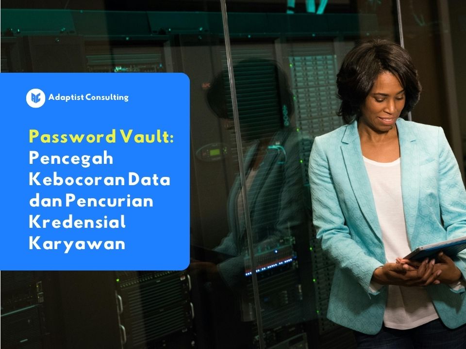 Seorang karyawan yang sedang fokus bekerja di depan layar komputer sambil mengakses data perusahaan secara aman menggunakan password vault.