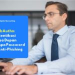 Karyawan yang sedang melakukan autentikasi passwordless menggunakan kunci keamanan fisik berbasis protokol WebAuthn untuk mengakses infrastruktur jaringan perusahaan secara aman.