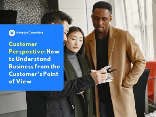 Three business professionals reviewing reports and documents at a table, discussing customer perspective analysis data together.