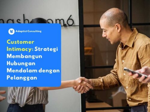 Dua profesional bisnis saling berjabat tangan sebagai simbol kepercayaan dan kedekatan hubungan dengan pelanggan