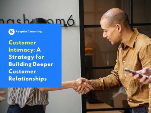 Two business professionals shaking hands as a symbol of trust and close customer relationships.